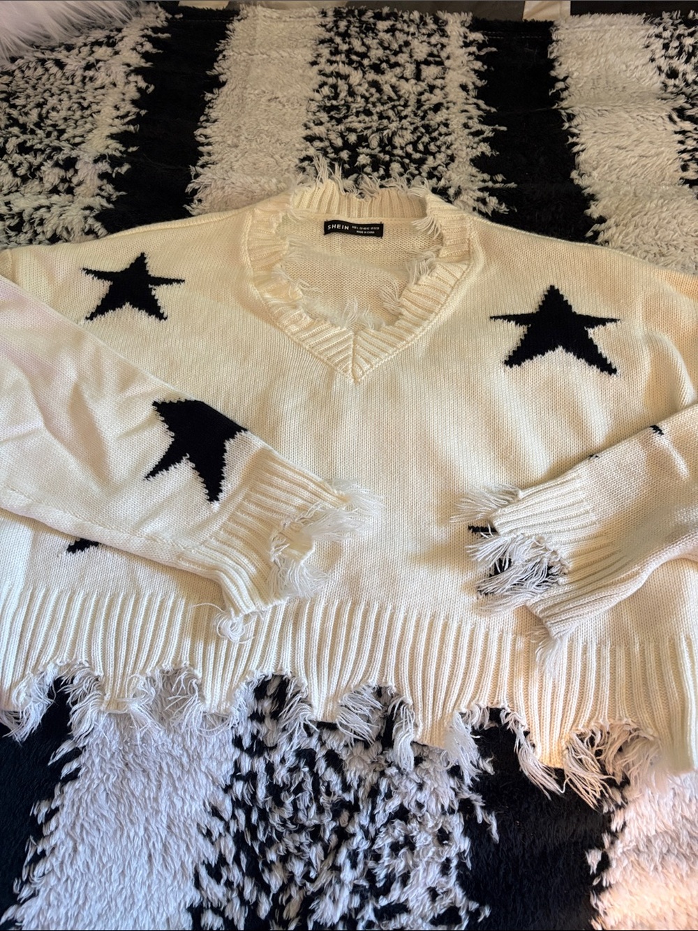 SHEIN Cream V-Neck Sweater with Black Star Accents